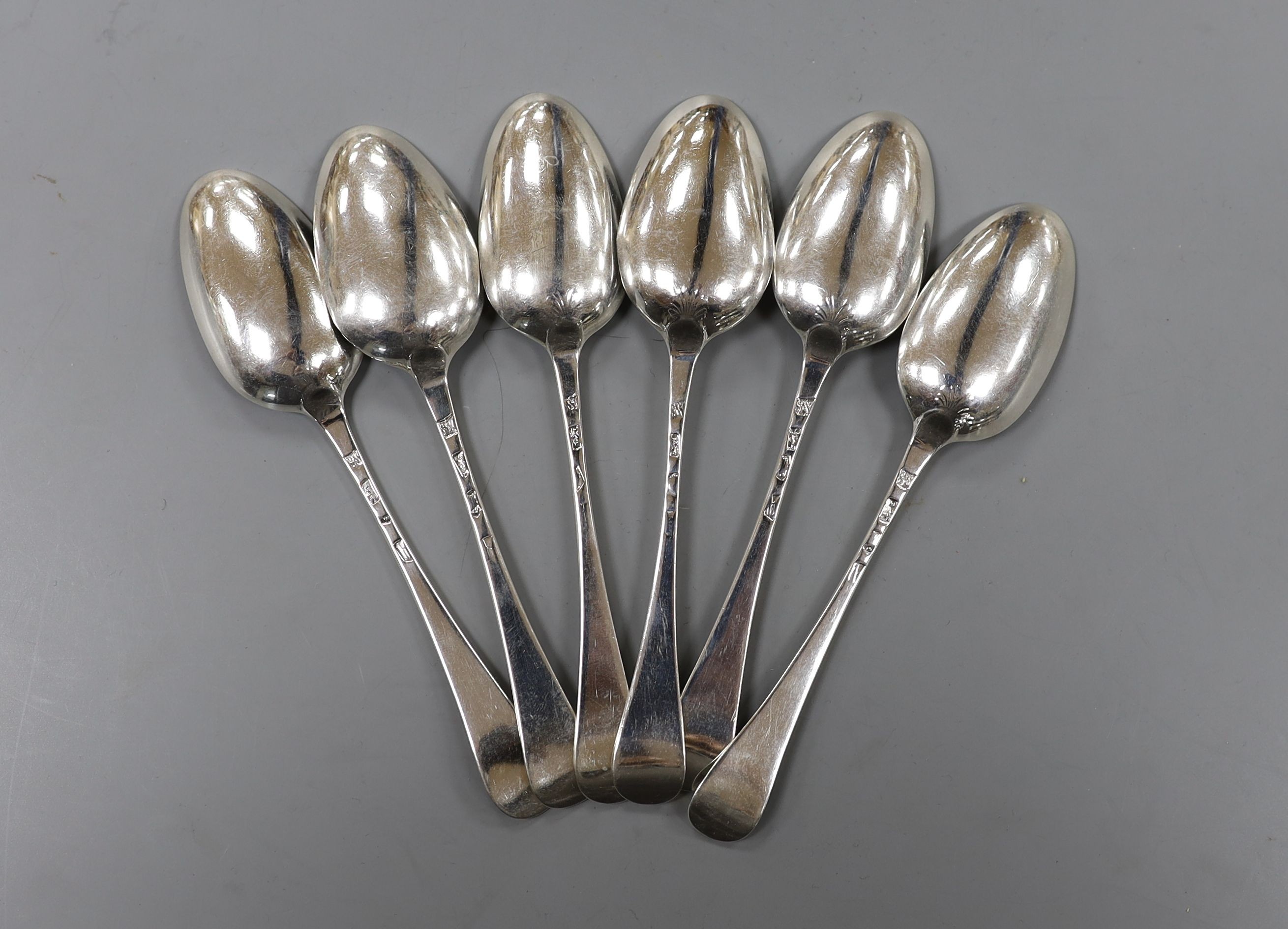 A set of six 18th century silver Old English pattern dessert spoons, indistinct marks, maker SW, possibly London, 1737, 16.5cm, 154 grams.